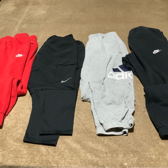Nike men Black and Red Joggers - Picture 1 of 3